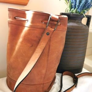 Thick leather over shoulder, tan leather